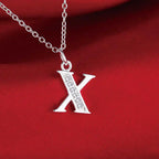 Collar largo con colgante inicial x