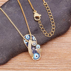 Collar con colgante Tongue Ojo Azul y Circonita