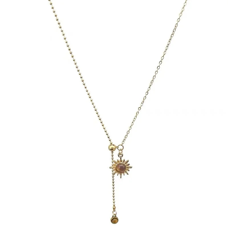 Tie necklace with sunburst charms and tiger's eye stones