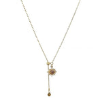 Tie necklace with sunburst charms and tiger's eye stones