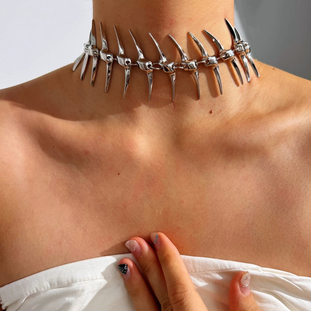 Back necklace with skeleton and skull pendant 