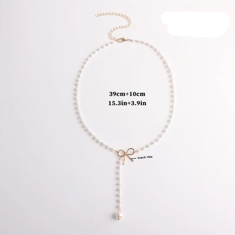 Collar de Perlas con Colgante de Nudo