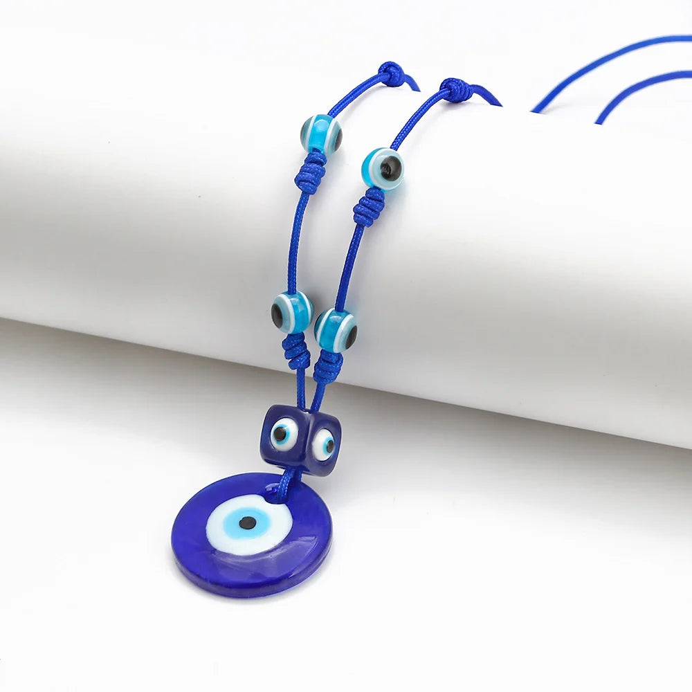Rope necklace with large blue eye pendant
