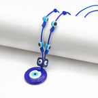 Rope necklace with large blue eye pendant