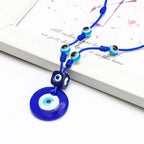 Rope necklace with large blue eye pendant