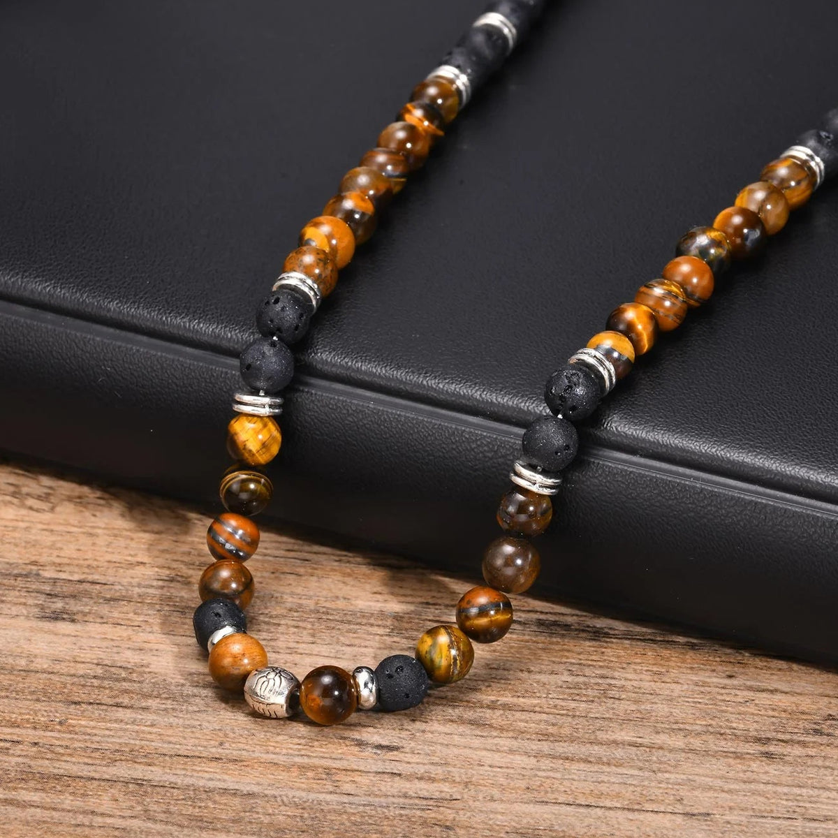 Lava stone and tiger's eye necklace with lotus flower pendant