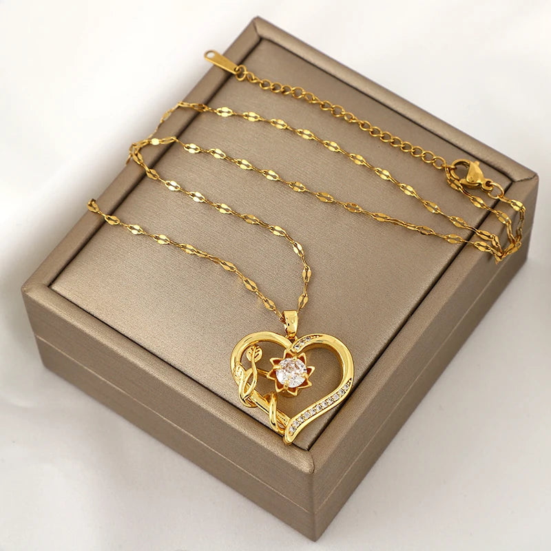 Collar colgante con corazón y flor giratoria antiestrés