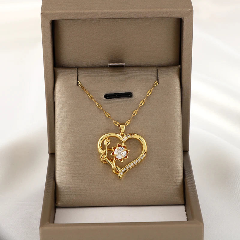 Collar colgante con corazón y flor giratoria antiestrés