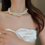 Collar trenzado con colgante de perla