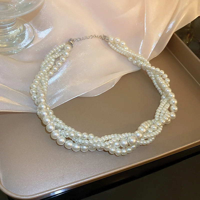 Collar trenzado con colgante de perla