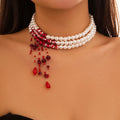 Collar de triple fila con colgante de perlas en cascada