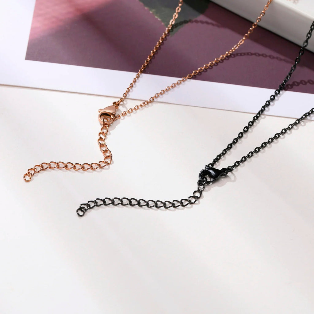 Collares para parejas con colgante de cruz negro y oro rosa