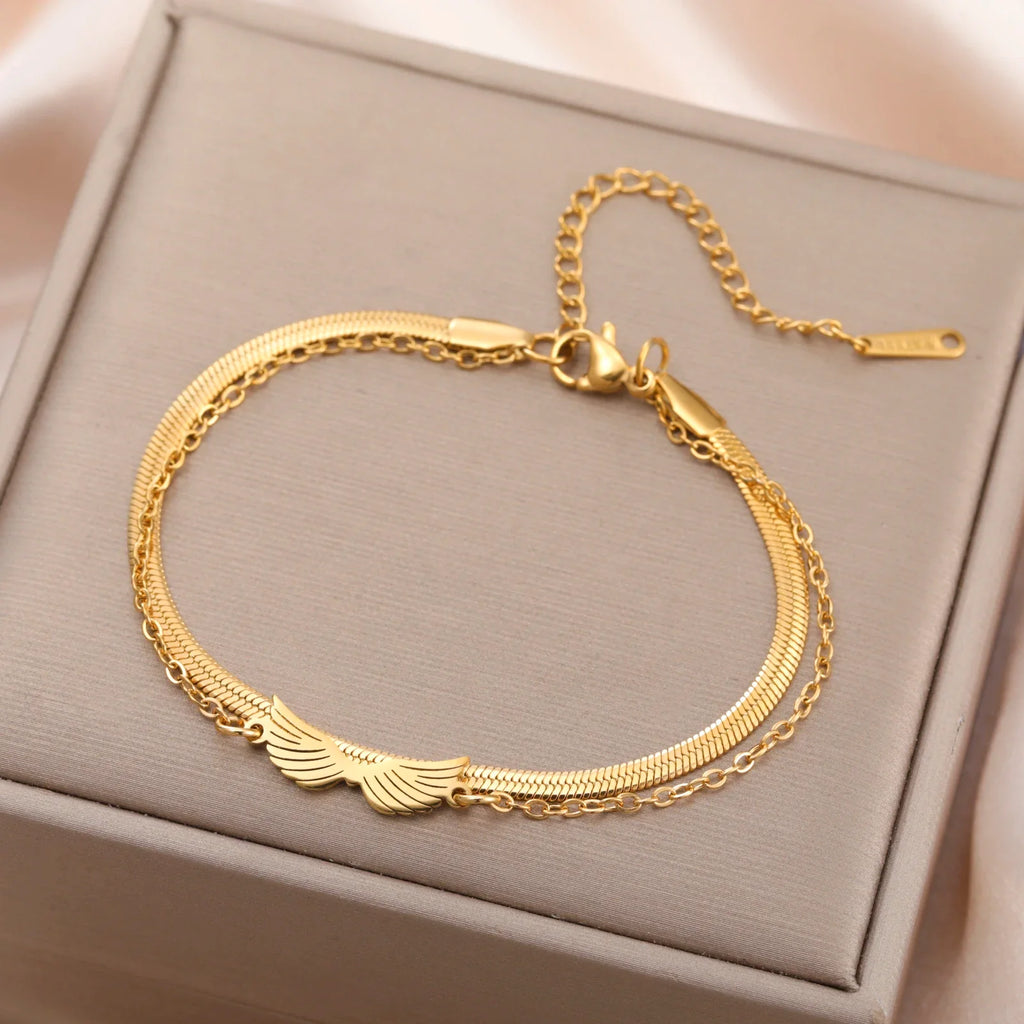 Pulsera doble alas de ángel oro