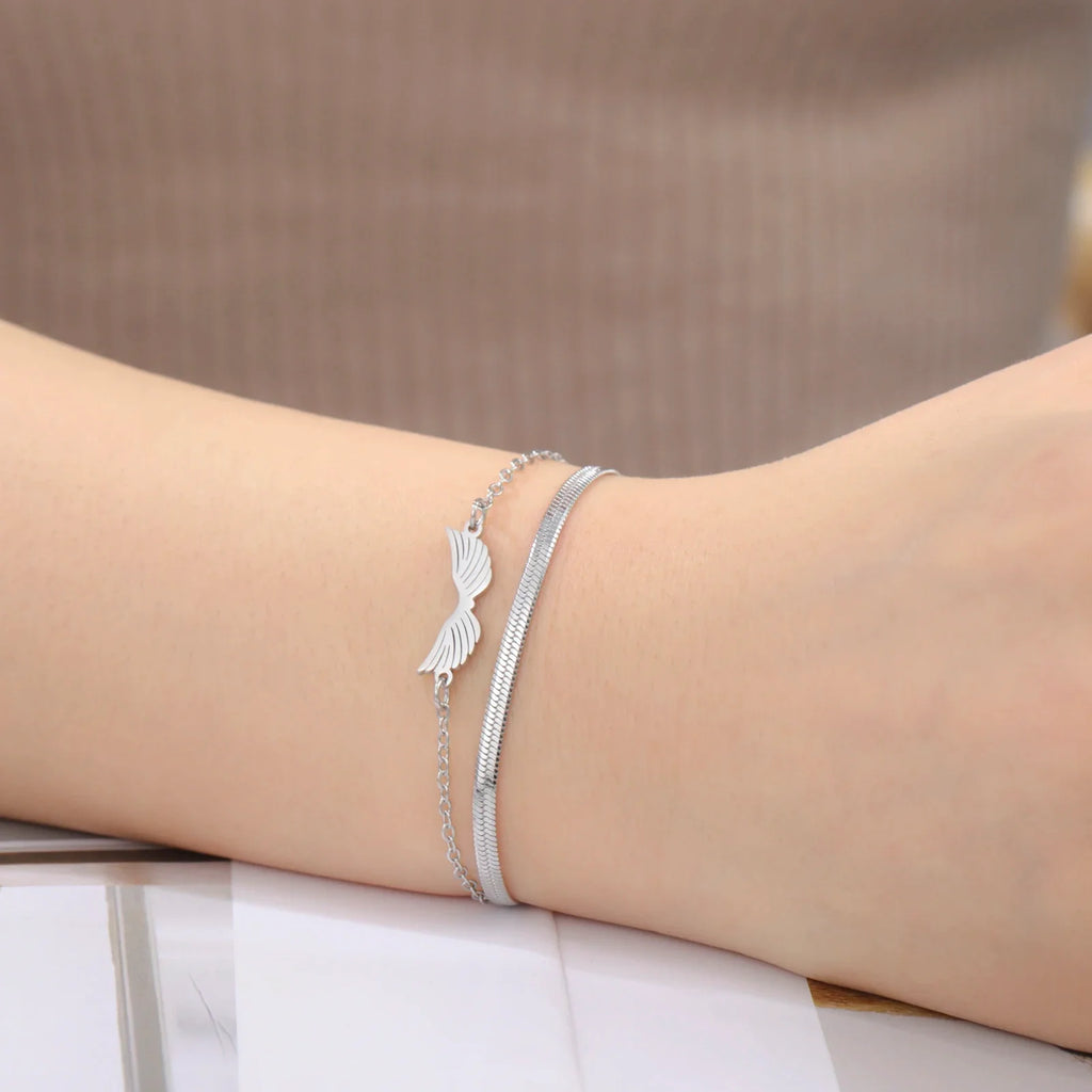 Pulsera doble alas de ángel plata