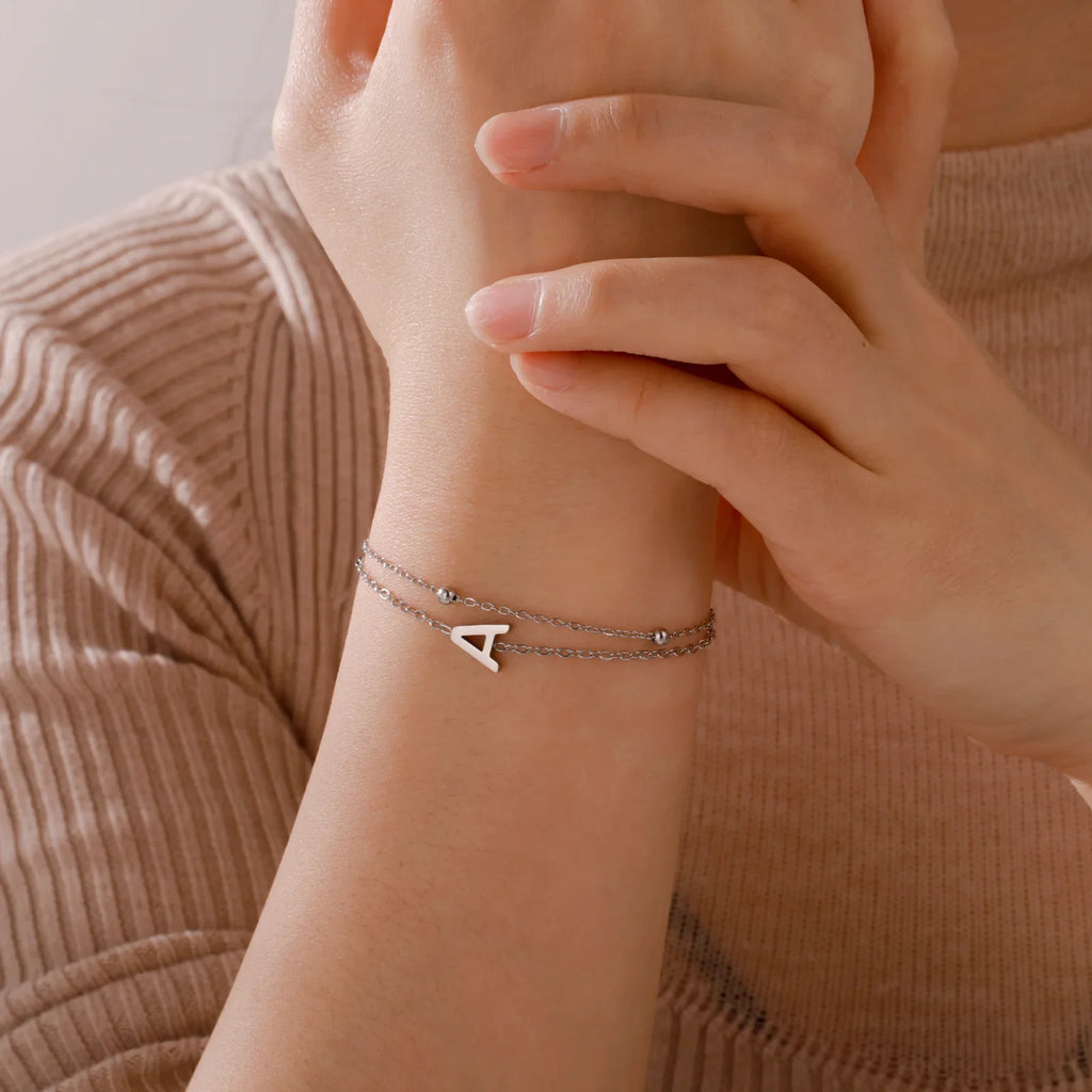 Pulsera de doble inicial oro y plata 