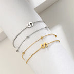 Pulsera de doble inicial oro y plata  s