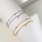 Pulsera de doble inicial oro y plata  l