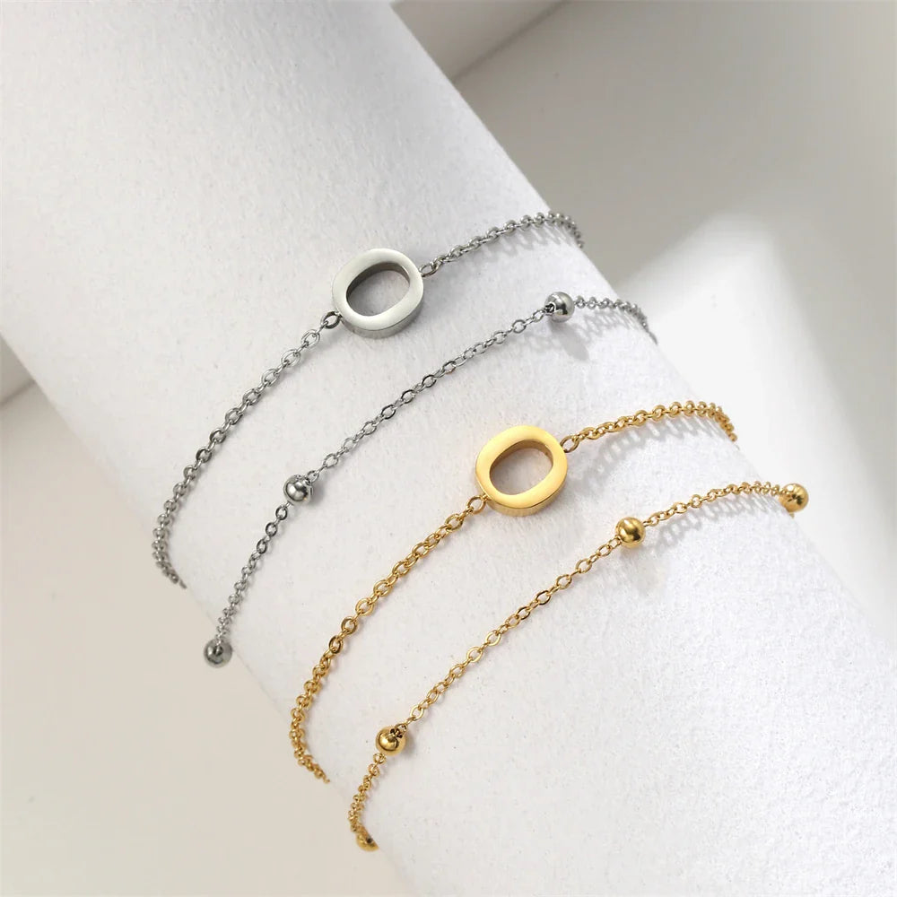 Pulsera de doble inicial oro y plata  o