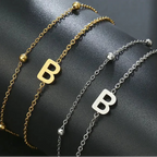 Pulsera de doble inicial oro y plata  b