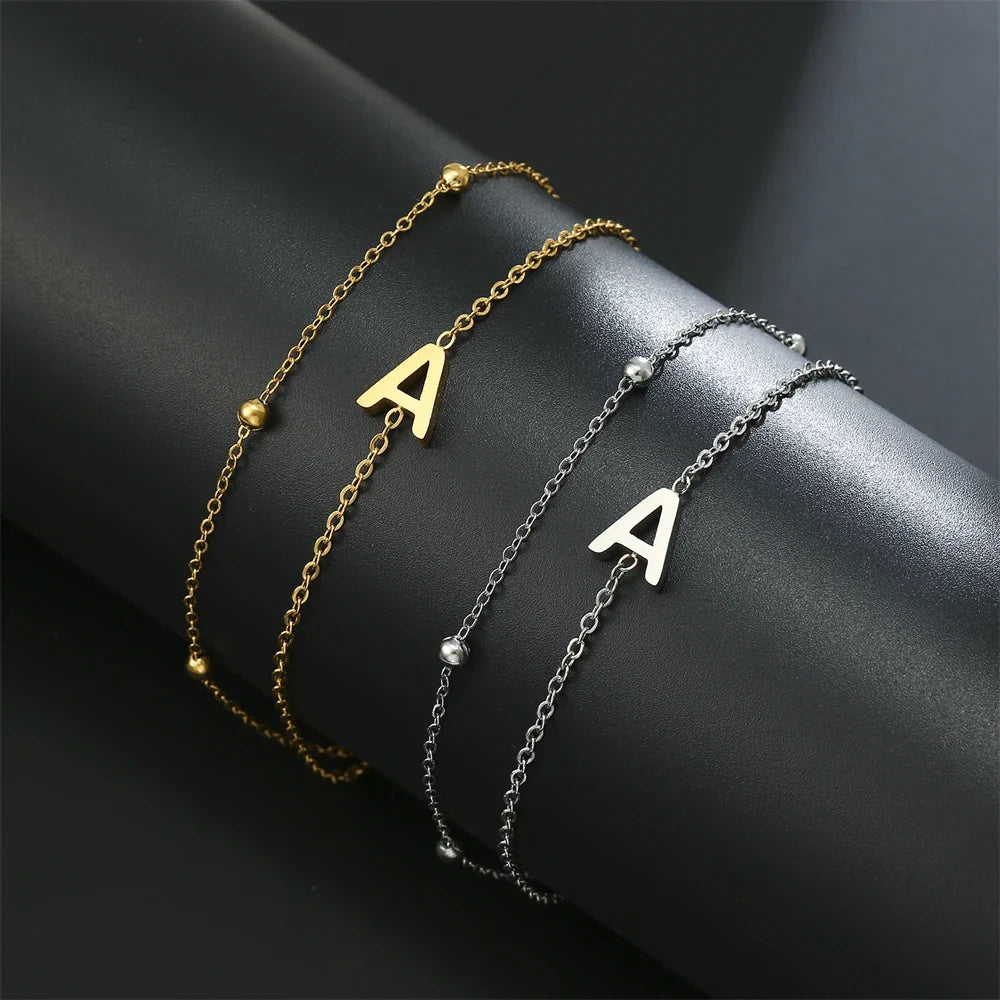 Pulsera de doble inicial oro y plata  a