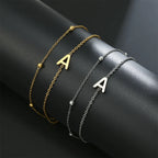 Pulsera de doble inicial oro y plata  a