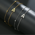 Pulsera de doble inicial oro y plata a