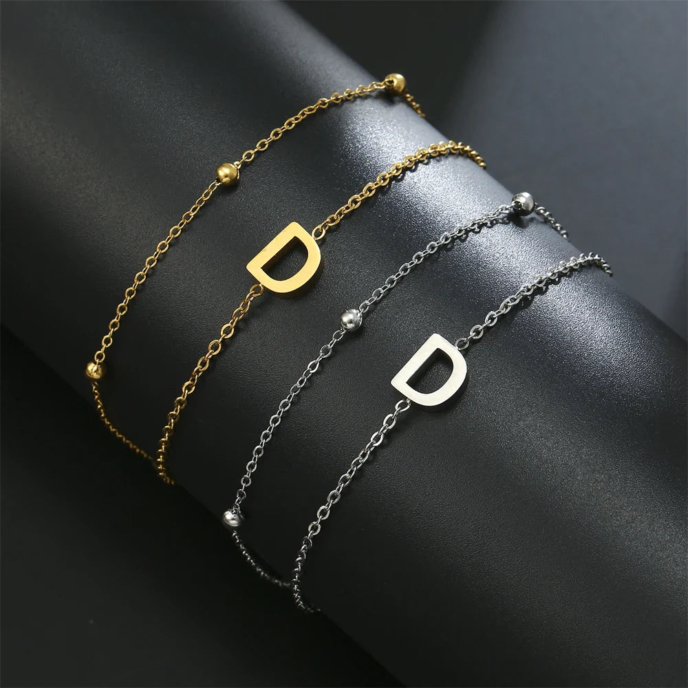 Pulsera de doble inicial oro y plata  d