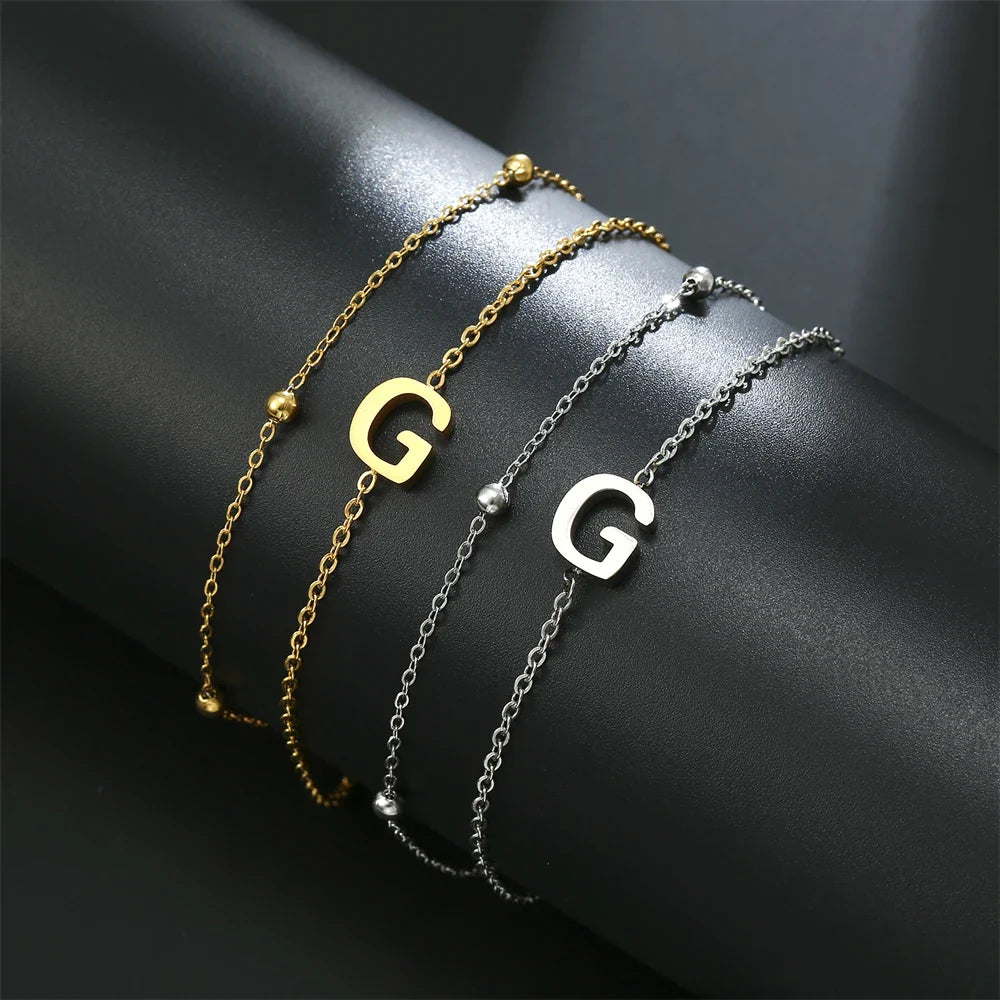 Pulsera de doble inicial oro y plata  g