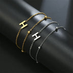 Pulsera de doble inicial oro y plata  h