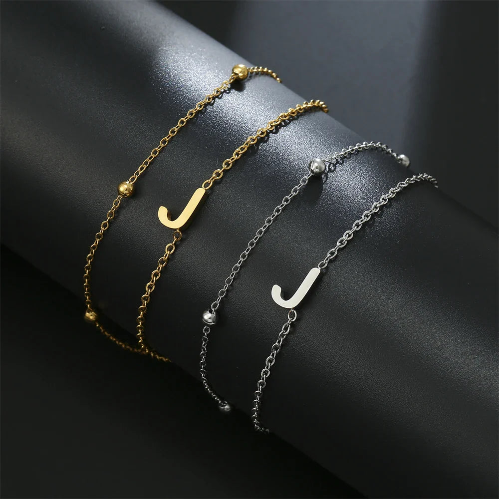 Pulsera de doble inicial oro y plata  j