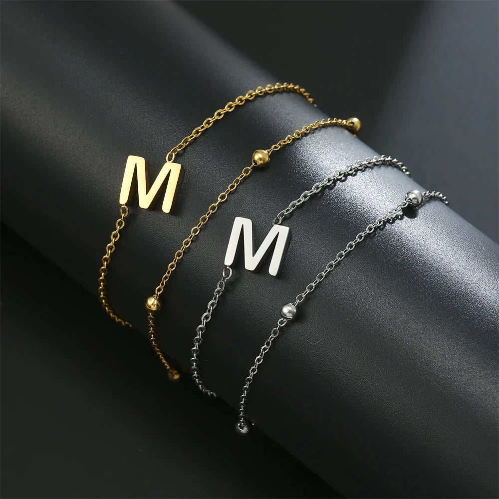 Pulsera de doble inicial oro y plata  m