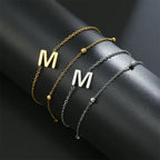 Pulsera de doble inicial oro y plata  m