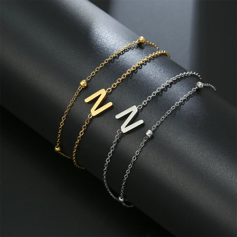 Pulsera de doble inicial oro y plata  n