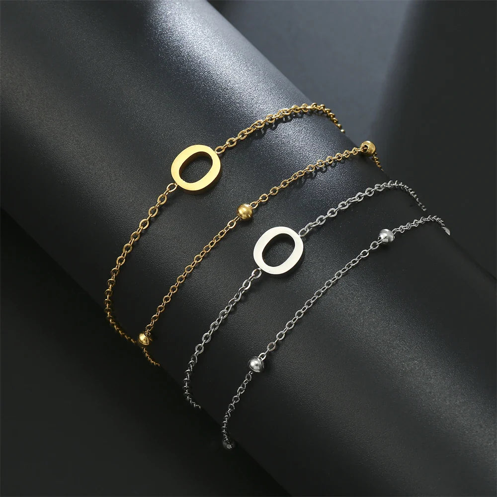 Pulsera de doble inicial oro y plata  o