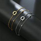 Pulsera de doble inicial oro y plata  q