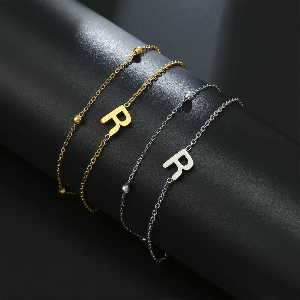 Pulsera de doble inicial oro y plata  r