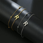 Pulsera de doble inicial oro y plata  r