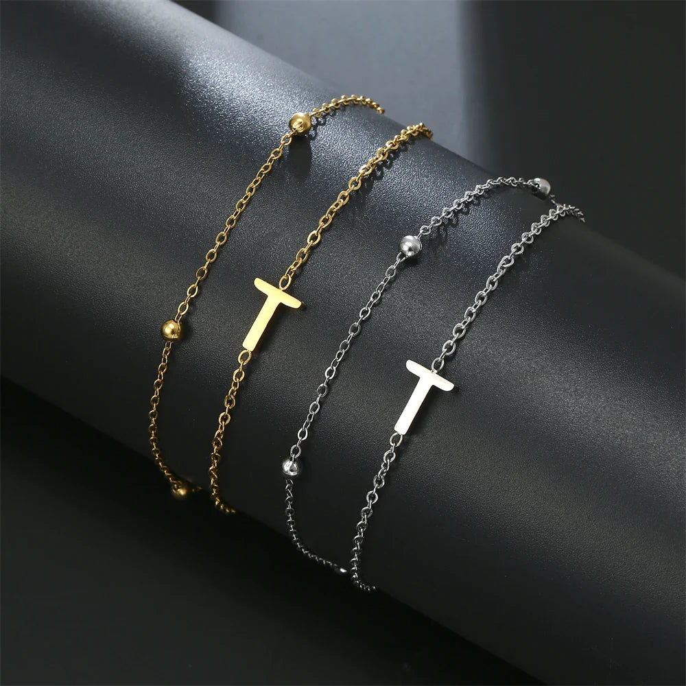 Pulsera de doble inicial oro y plata  t
