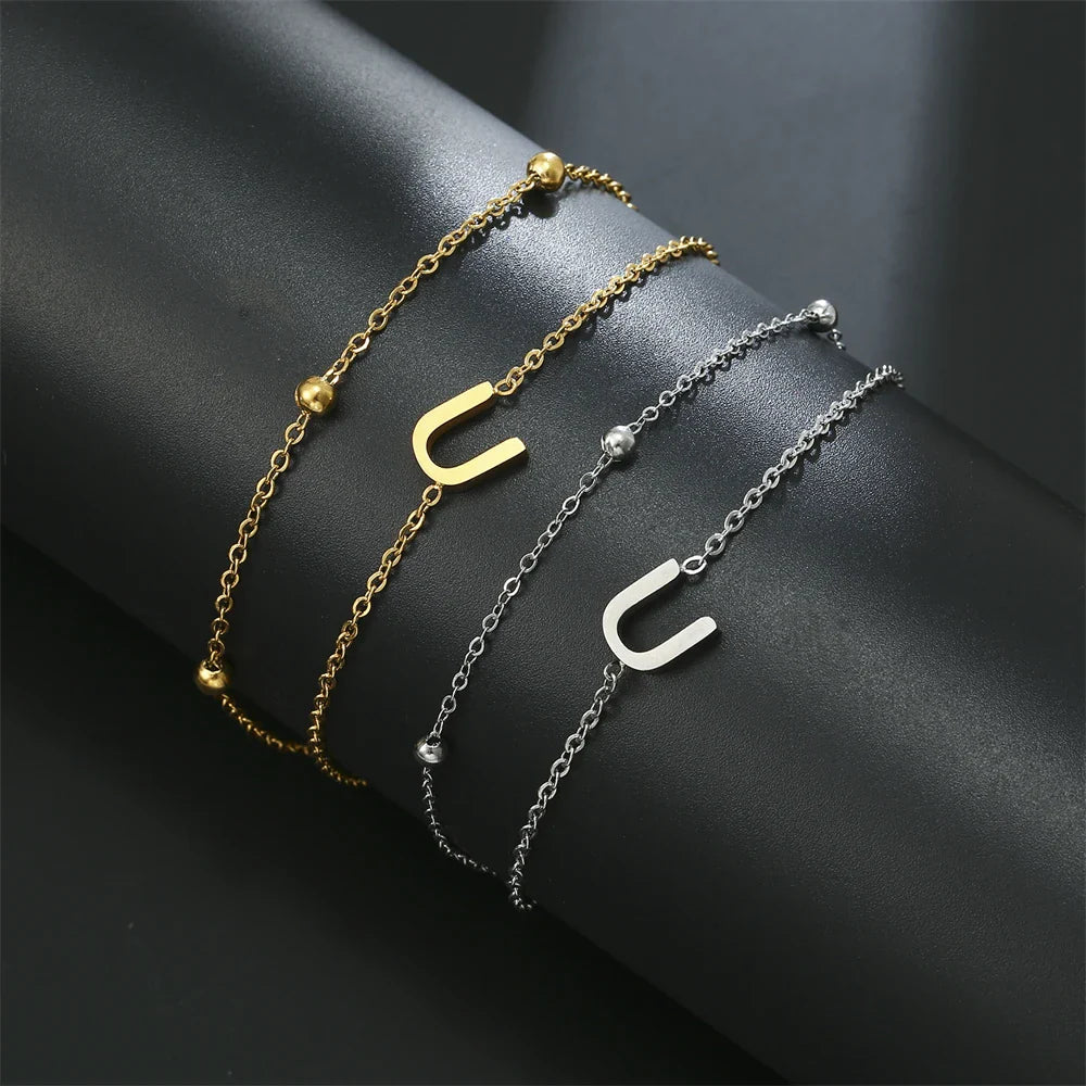 Pulsera de doble inicial oro y plata  u