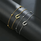 Pulsera de doble inicial oro y plata  u