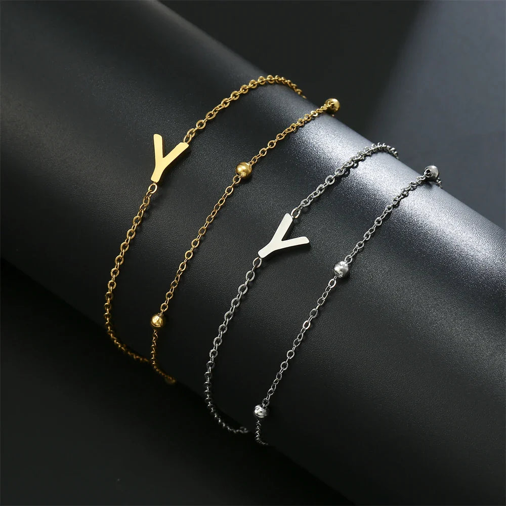 Pulsera de doble inicial oro y plata  y