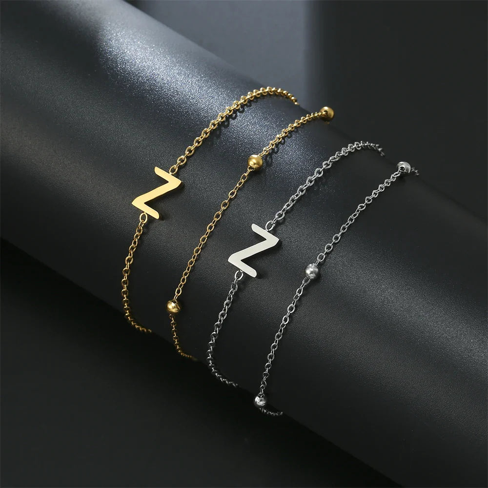 Pulsera de doble inicial oro y plata  z