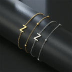 Pulsera de doble inicial oro y plata  z