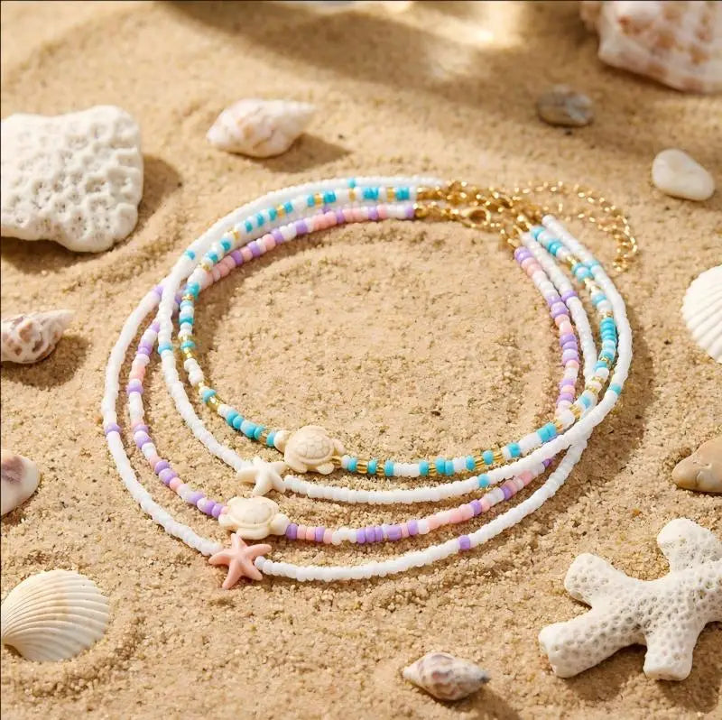 Doble collar de concha y perlas de colores azul tortuga