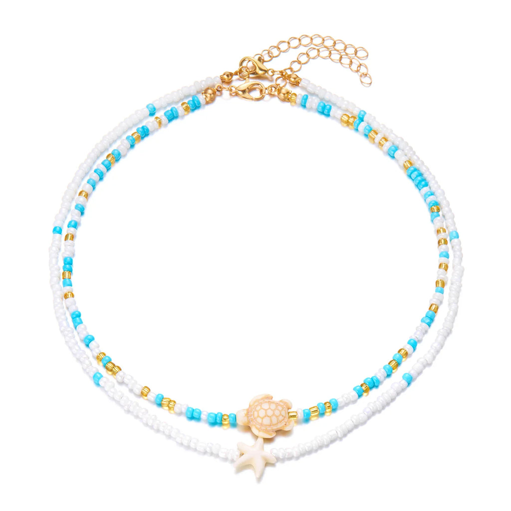 Doble collar de concha y perlas de colores azul tortuga