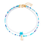 Doble collar de concha y perlas de colores azul estrella