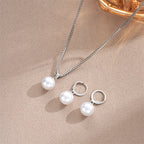 Conjunto de collar con colgante y pendientes colgantes de perla estilo contemporáneo plata