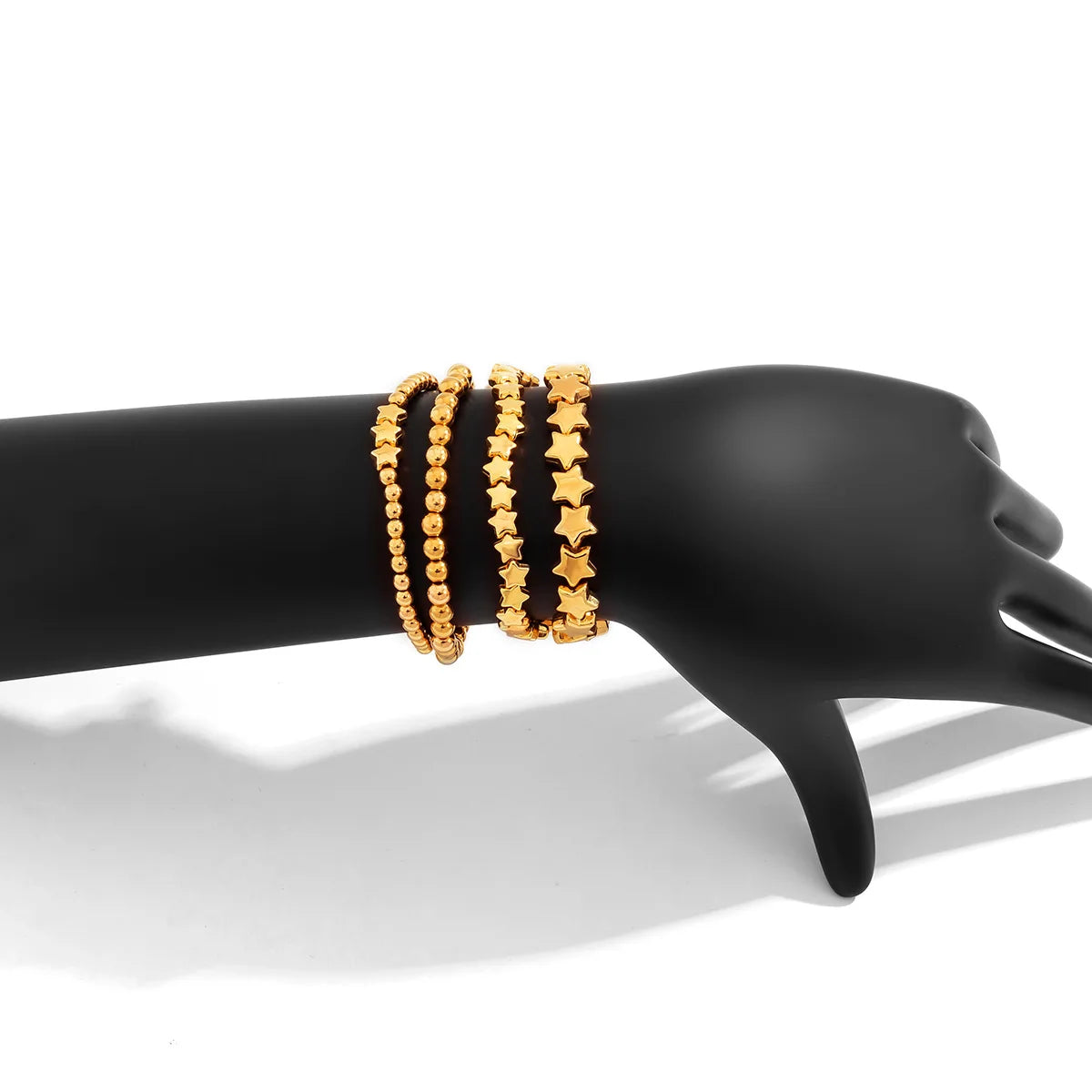 Lote de 4 Pulseras Estrellas oro