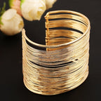 Pulsera rígida gruesa oro y plata para mujer oro